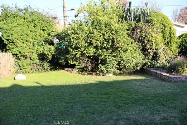 a view of entryway of house with yard and green space