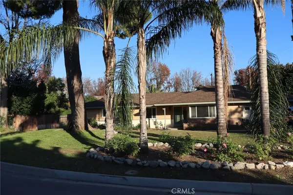 front view of a house with a garden