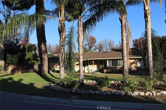 front view of a house with a garden