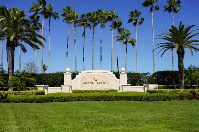 a view of house with swimming pool and green space