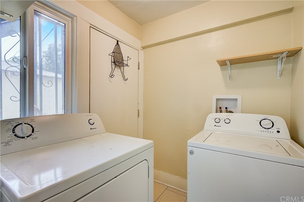 4708 San Pedro Street Los Angeles, CA 90011 - Photo 15 of 19 a utility room with dryer and washer