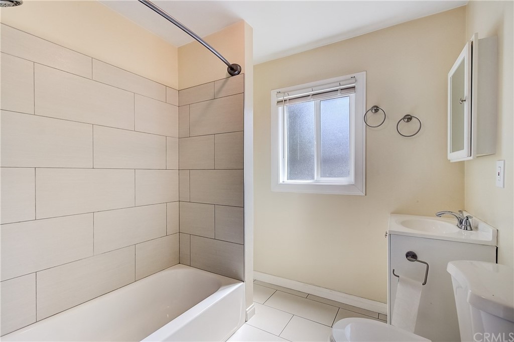 4708 San Pedro Street Los Angeles, CA 90011 - Photo 16 of 19 a bathroom with a bathtub and a sink