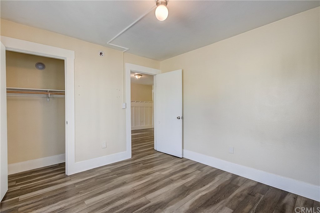 4708 San Pedro Street Los Angeles, CA 90011 - Photo 8 of 19 a view of an empty room with wooden floor