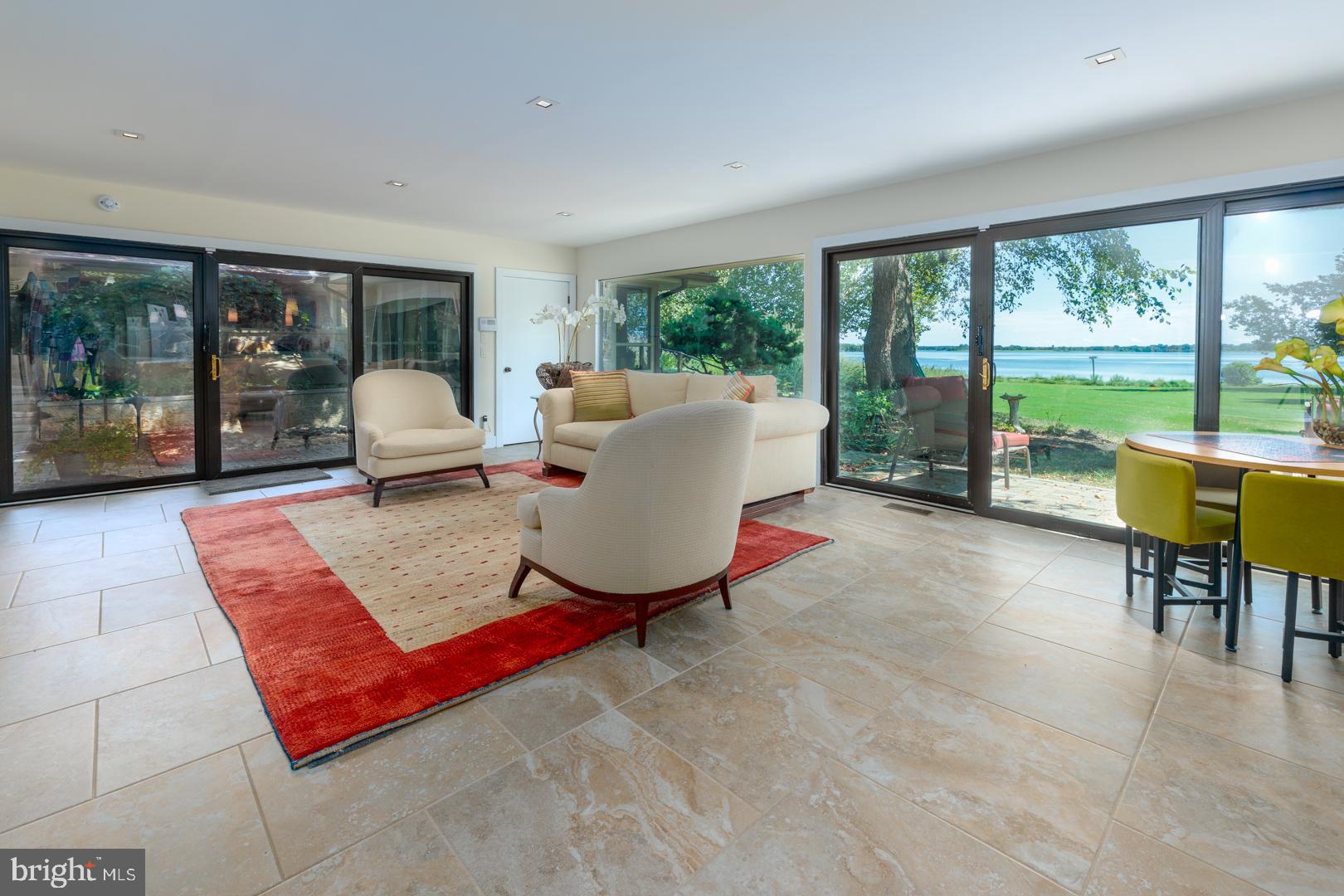 3207 Bennett Point Road Queenstown, MD 21658 - Photo 31 of 69 a living room with patio couch and floor to ceiling window