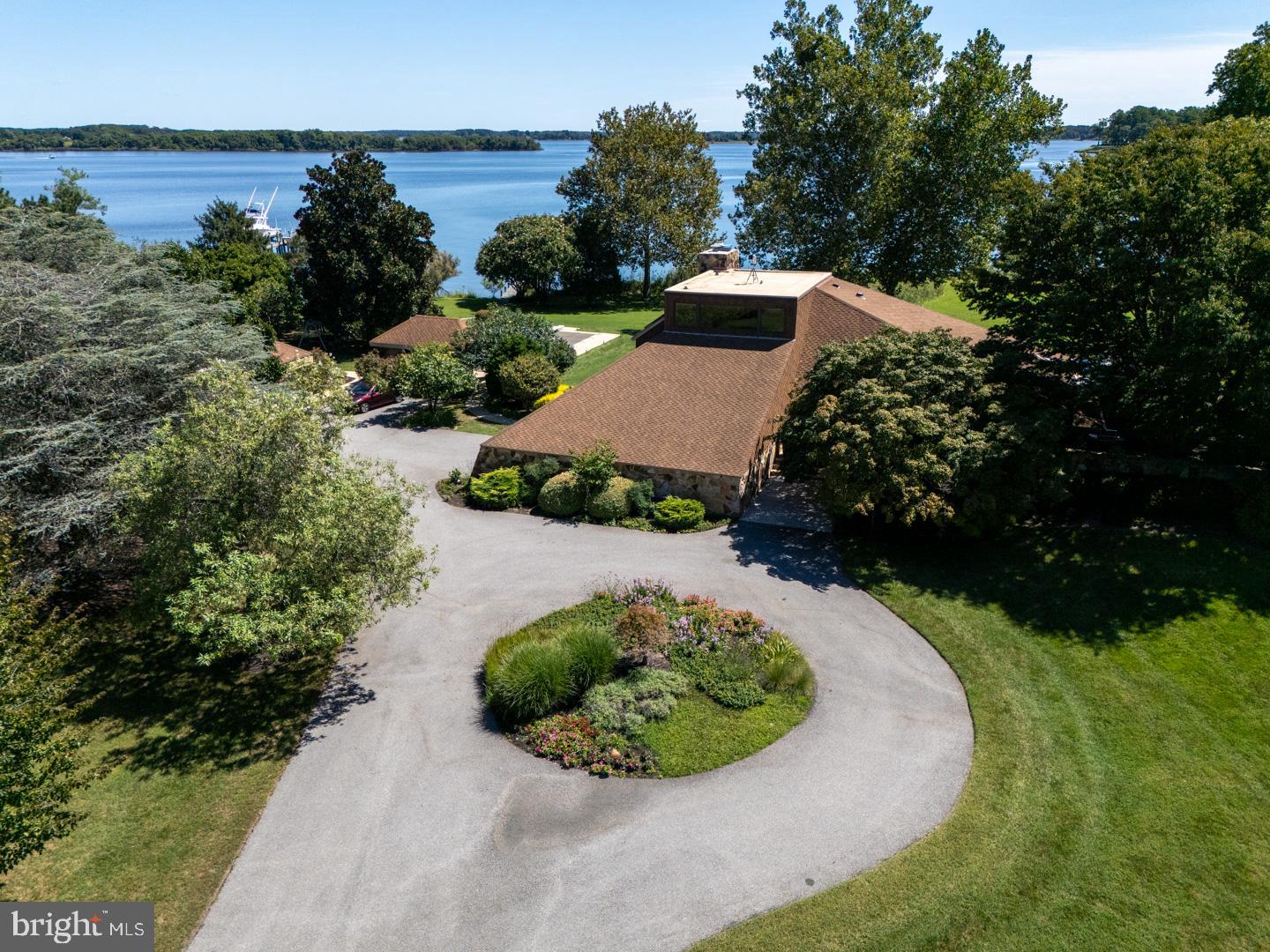 3207 Bennett Point Road Queenstown, MD 21658 - Photo 33 of 69 an aerial view of a house with a yard and lake view in back