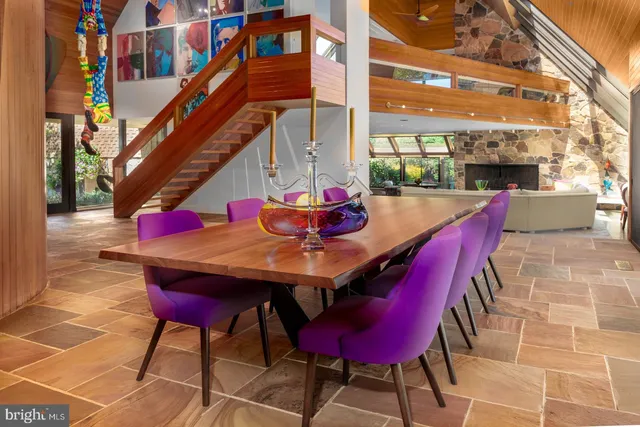 an aerial view of a house with a yard table and chairs