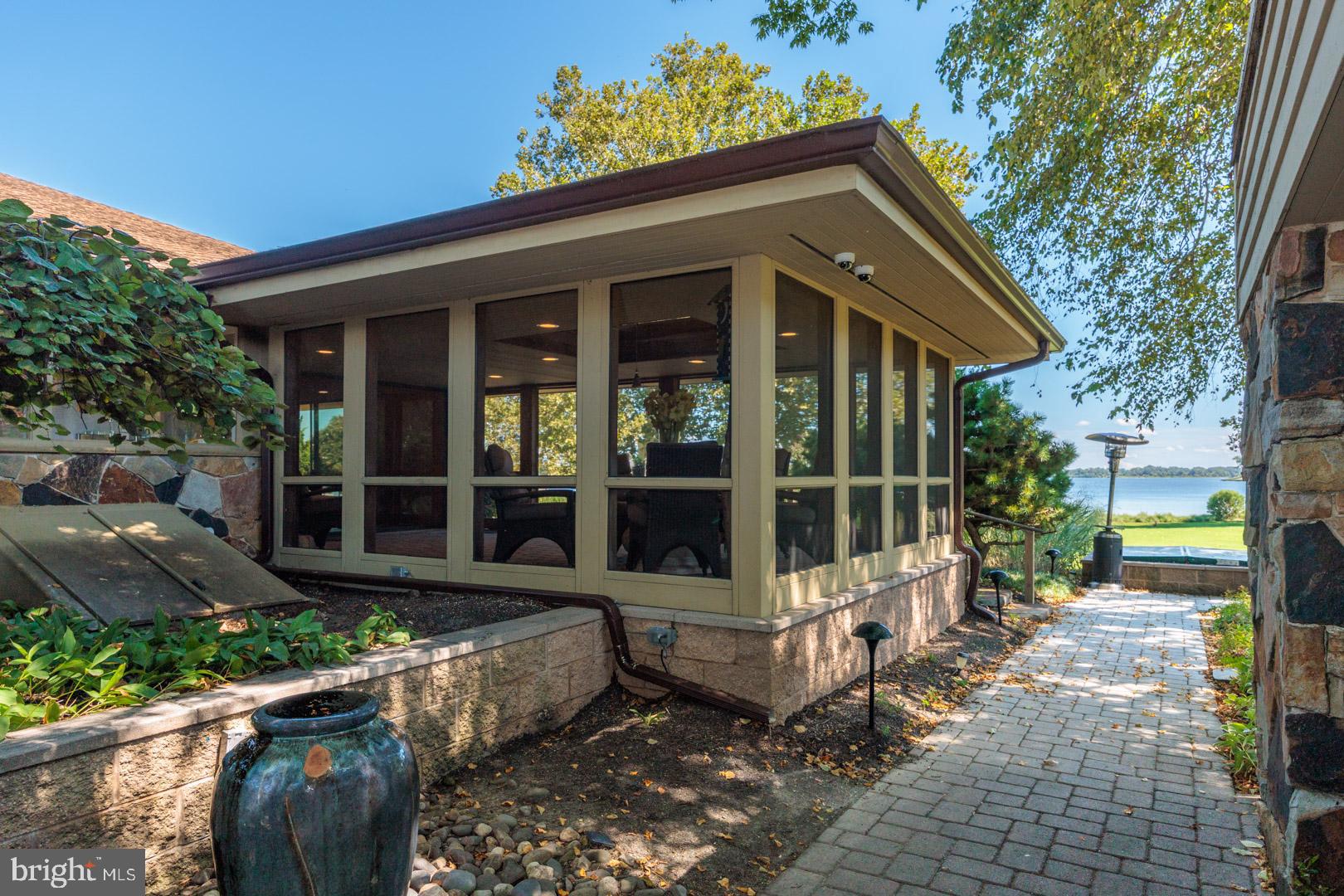 3207 Bennett Point Road Queenstown, MD 21658 - Photo 42 of 69 a view of a house with a small yard and plants