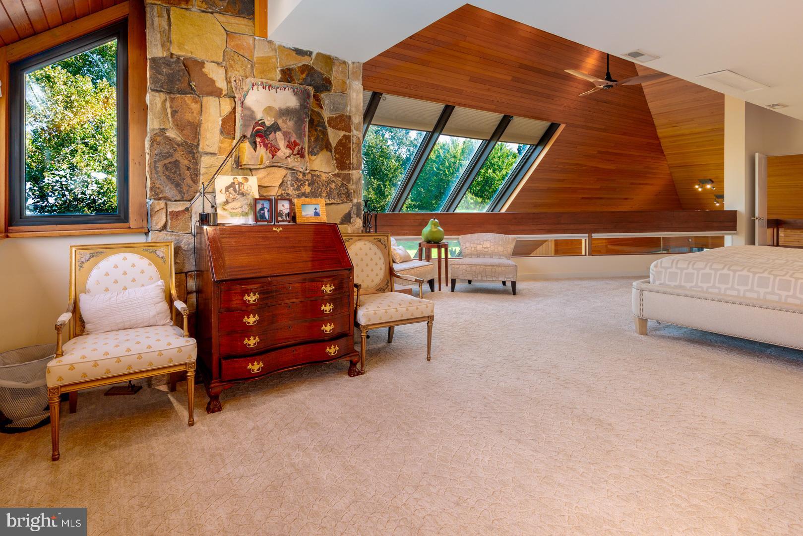 3207 Bennett Point Road Queenstown, MD 21658 - Photo 46 of 69 a bedroom with a bed and a couch next to a window