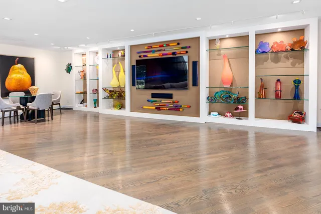 a view of a flower in a yard with a fountain