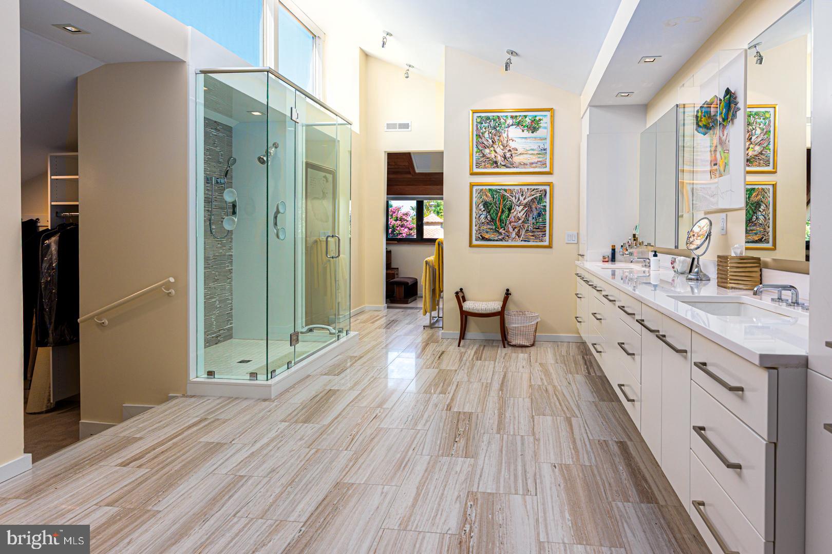 3207 Bennett Point Road Queenstown, MD 21658 - Photo 48 of 69 a large white room with a large window and a wooden floor