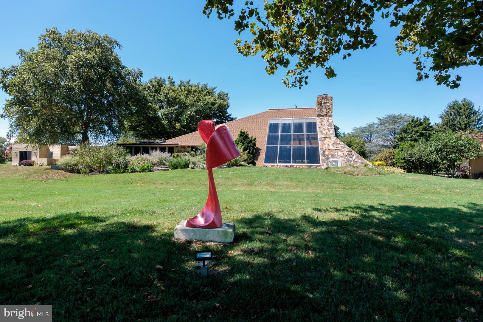 3207 Bennett Point Road Queenstown, MD 21658 - Photo 57 of 69 a front view of a house with garden and tree