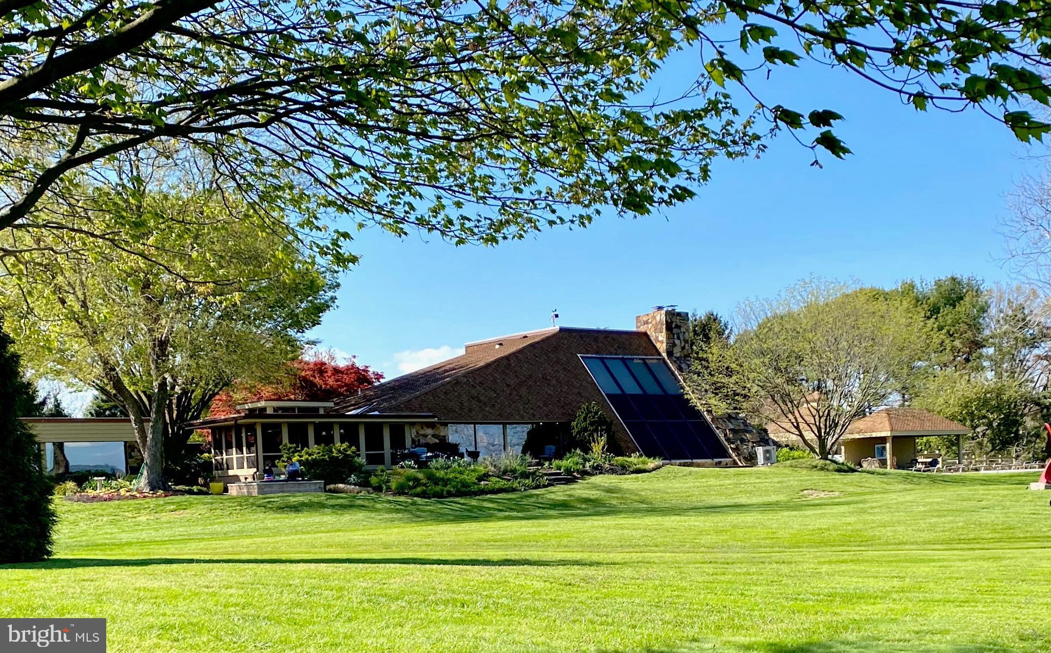 3207 Bennett Point Road Queenstown, MD 21658 - Photo 66 of 69 a front view of a house with a garden