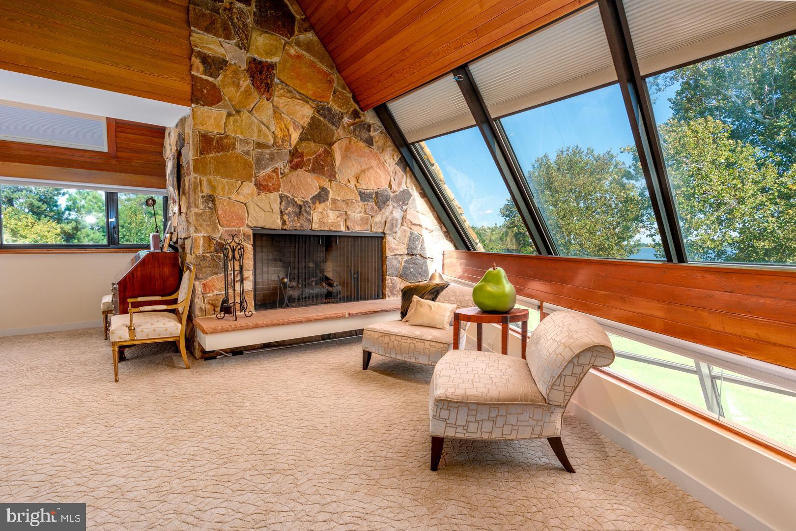 3207 Bennett Point Road Queenstown, MD 21658 - Photo 8 of 69 a outdoor living space with furniture and a fireplace