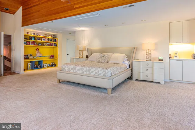 a bathroom with a sink vanity and a mirror