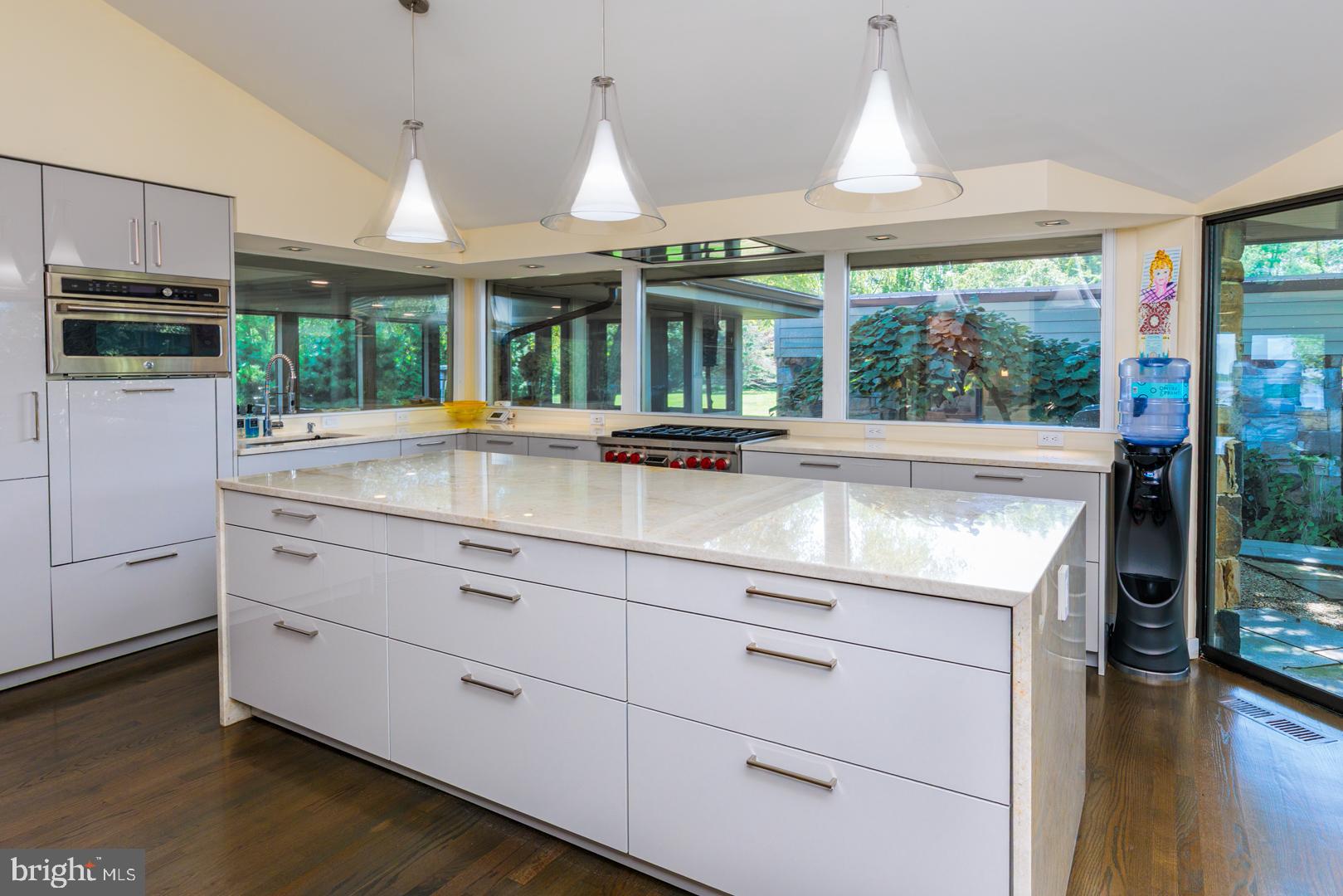 3207 Bennett Point Road Queenstown, MD 21658 - Photo 10 of 69 a kitchen with granite countertop white cabinets and a large window