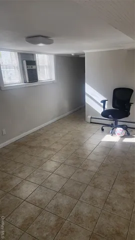 a view of an empty room with windows