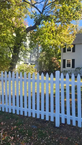 a view of a wooden fence