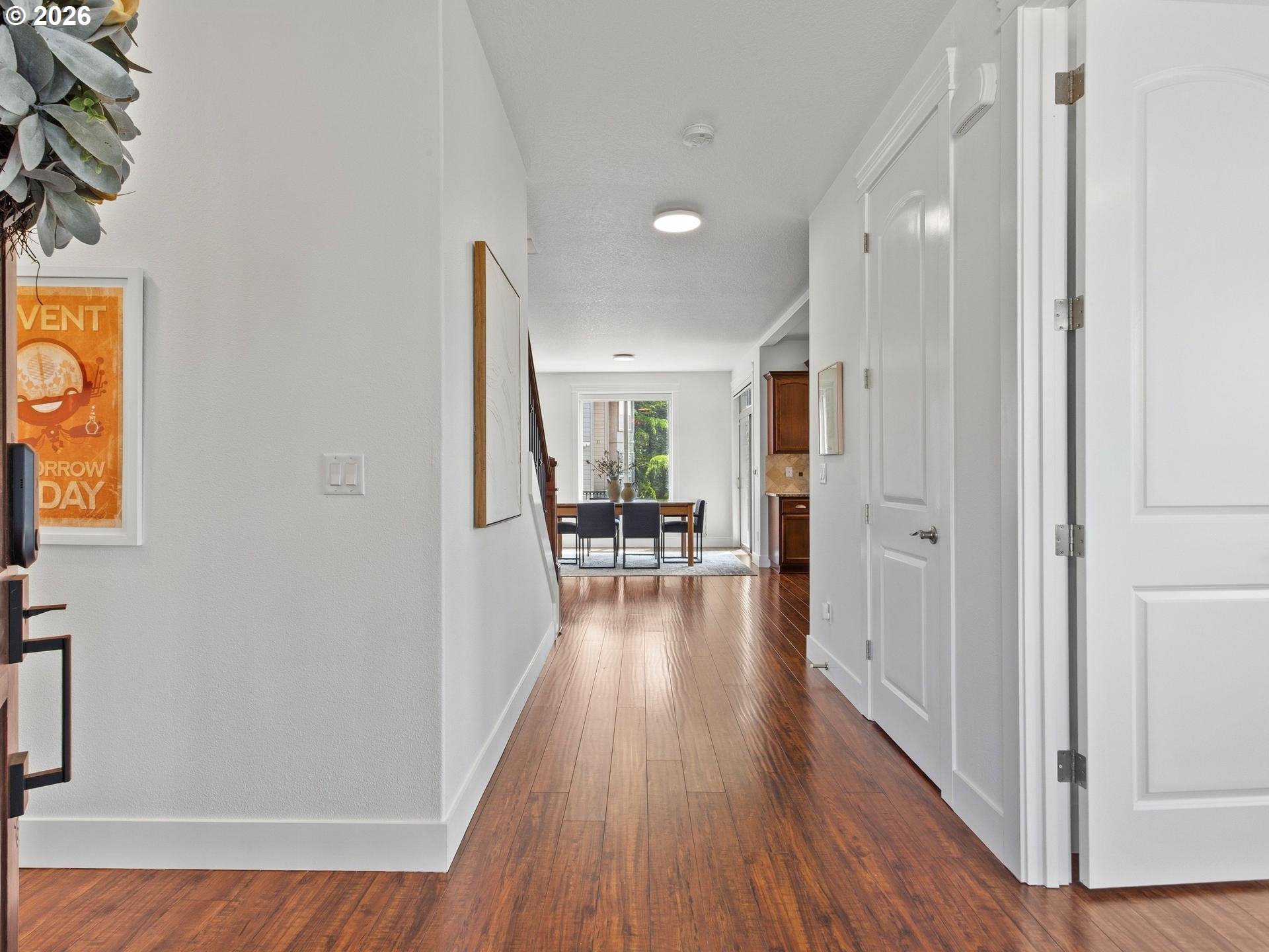 1012 Northwest Goodwin Street Camas, WA 98607 - Photo 3 of 44 a view of a hallway with wooden floor table and chairs