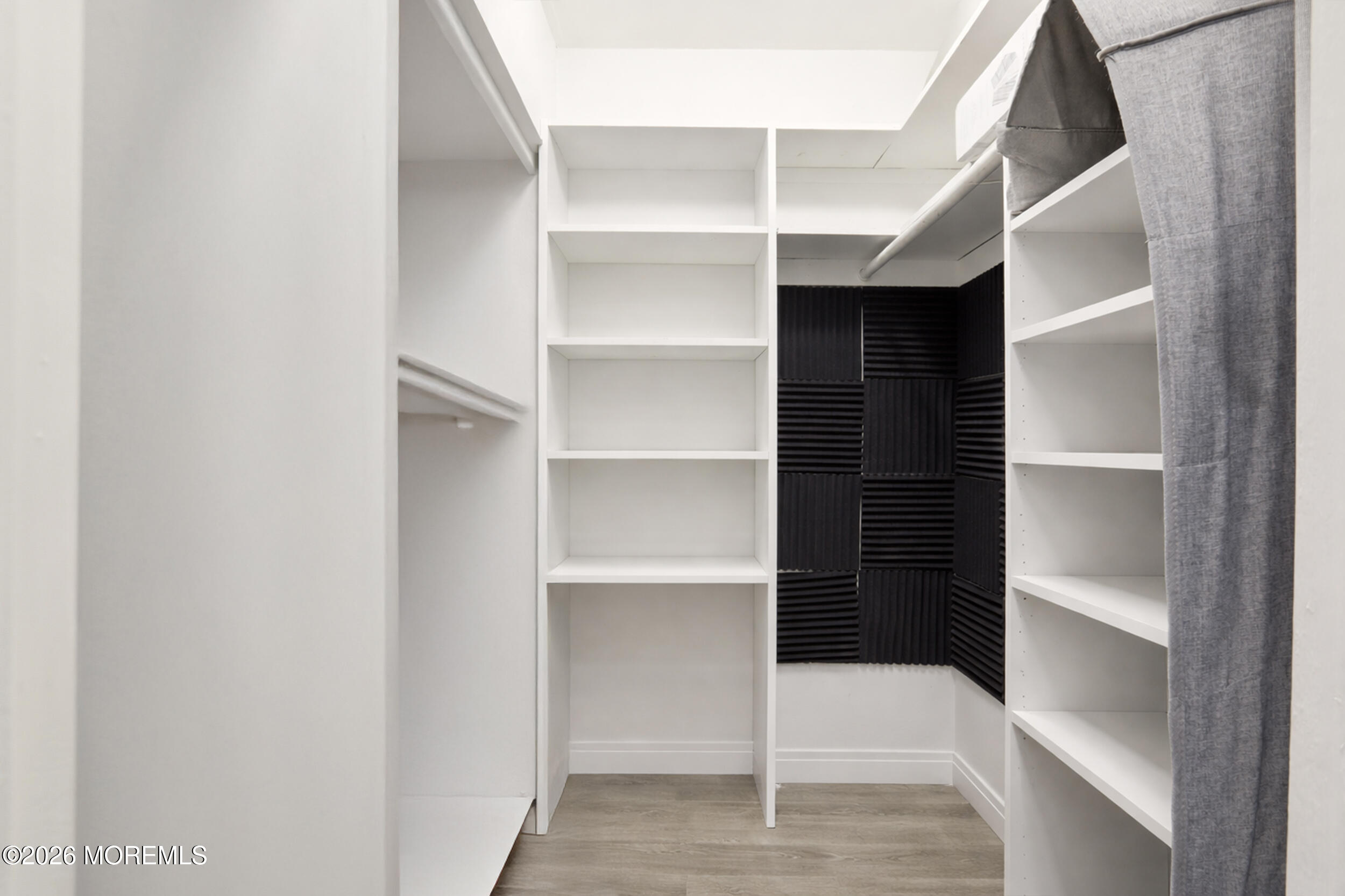 330 Shore Drive, Unit B7 Highlands, NJ 07732 - Photo 1 of 22 a view of walk in closet with empty racks