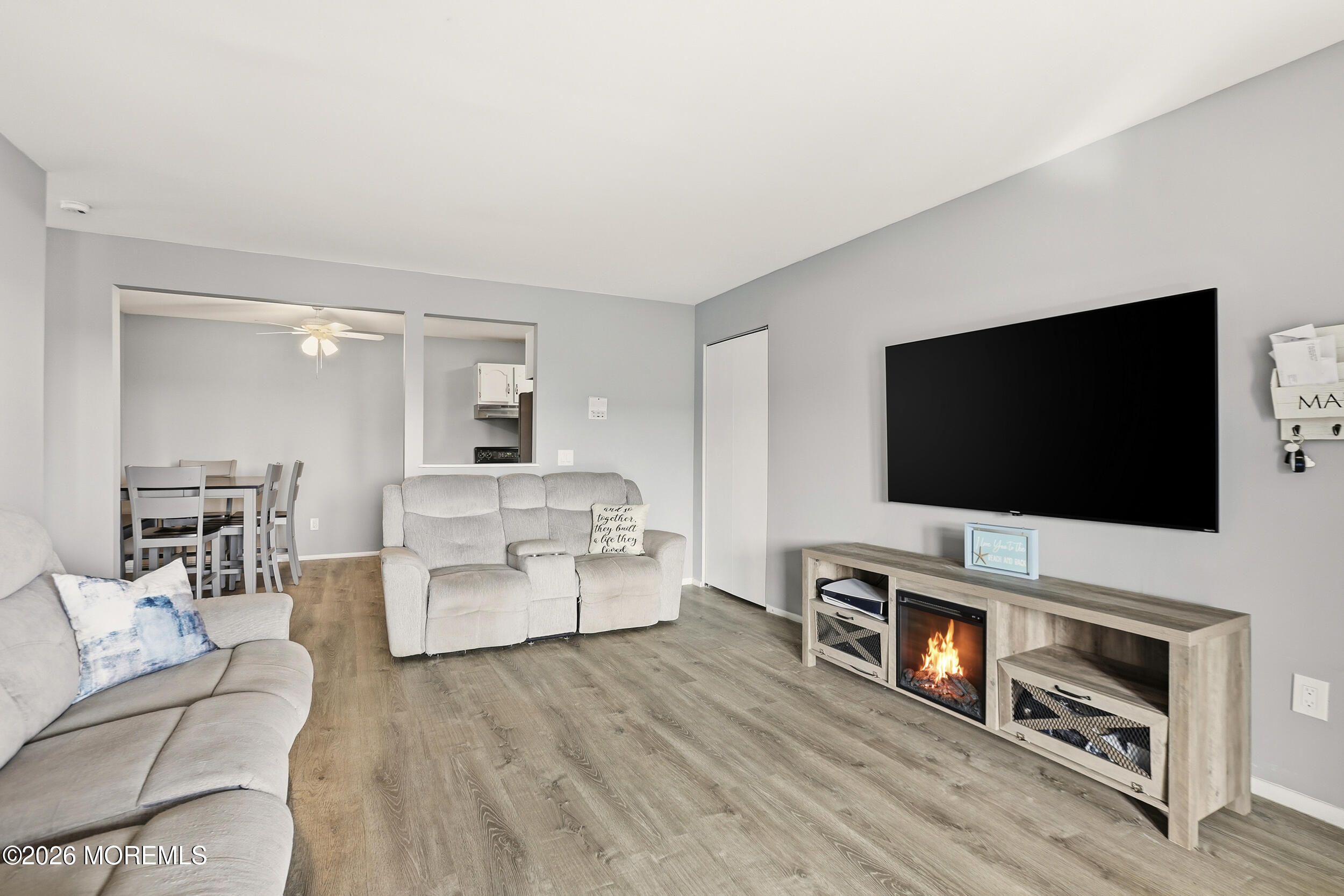 330 Shore Drive, Unit B7 Highlands, NJ 07732 - Photo 11 of 22 a living room with furniture and a flat screen tv