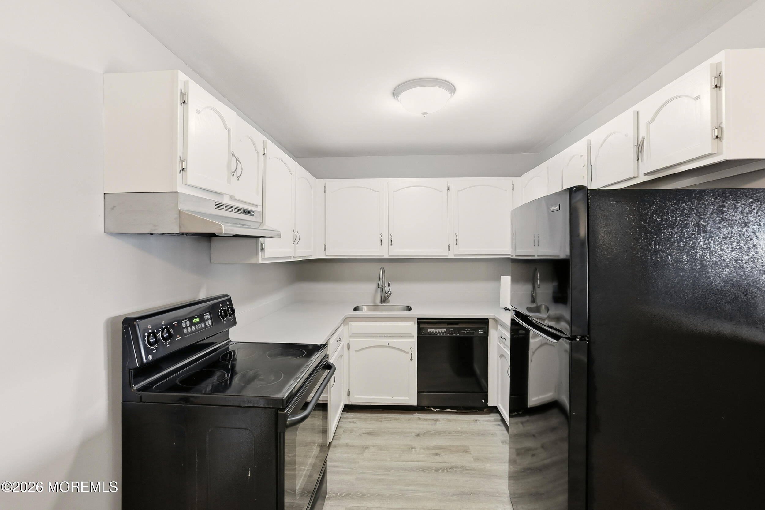 330 Shore Drive, Unit B7 Highlands, NJ 07732 - Photo 13 of 22 a kitchen with stainless steel appliances granite countertop a refrigerator and a stove