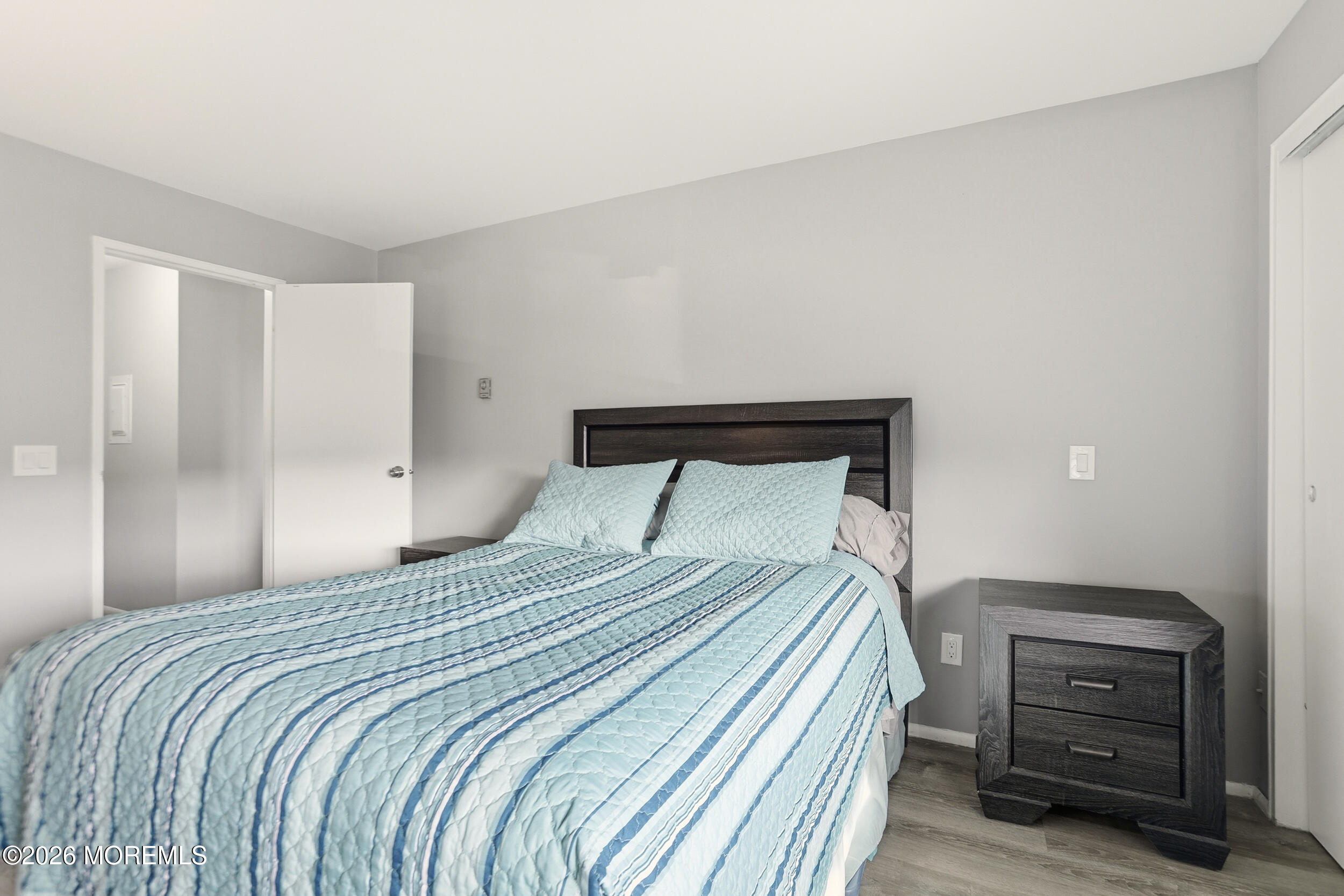 330 Shore Drive, Unit B7 Highlands, NJ 07732 - Photo 17 of 22 a bedroom with a bed and a dresser