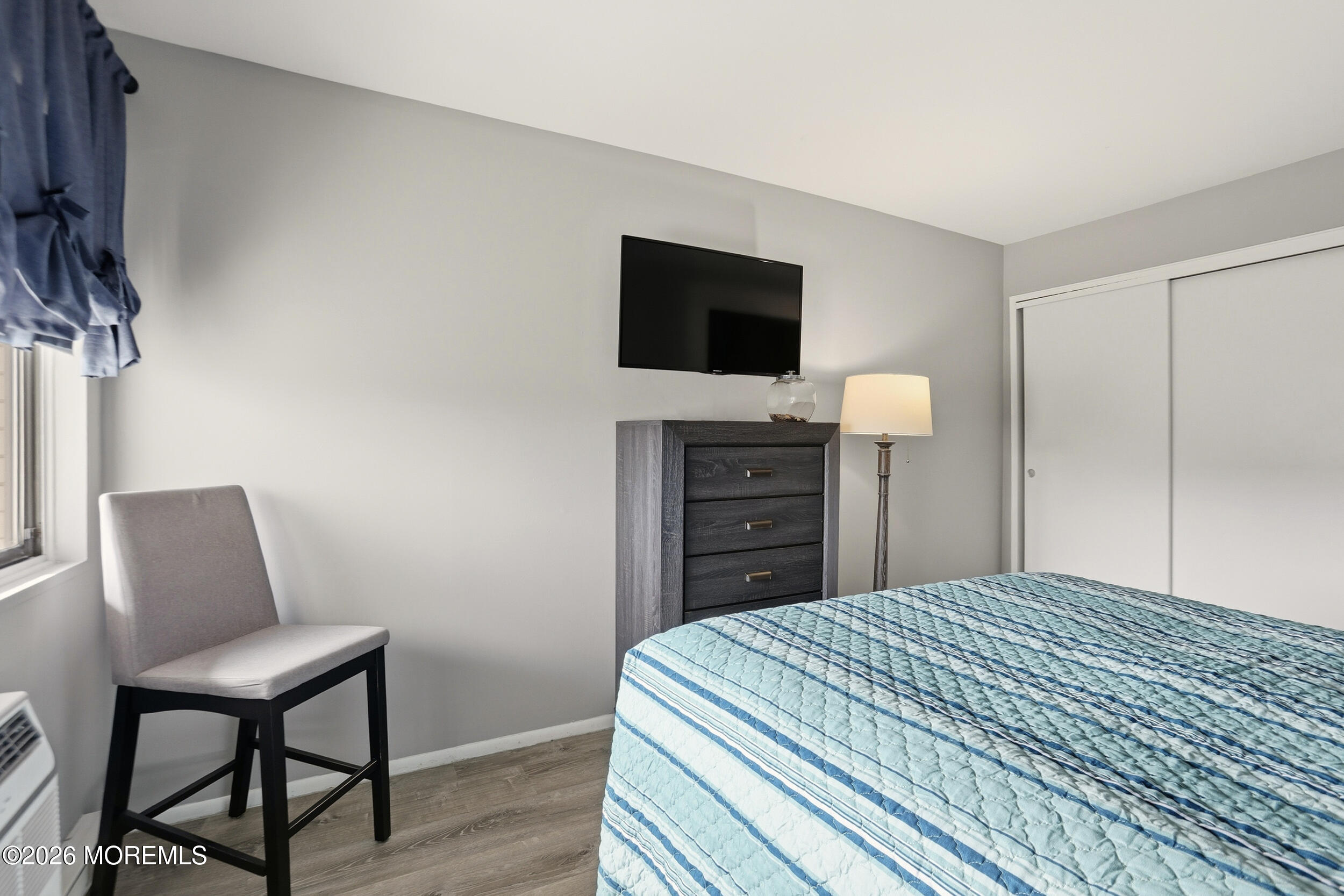 330 Shore Drive, Unit B7 Highlands, NJ 07732 - Photo 18 of 22 a bedroom with a bed and a television