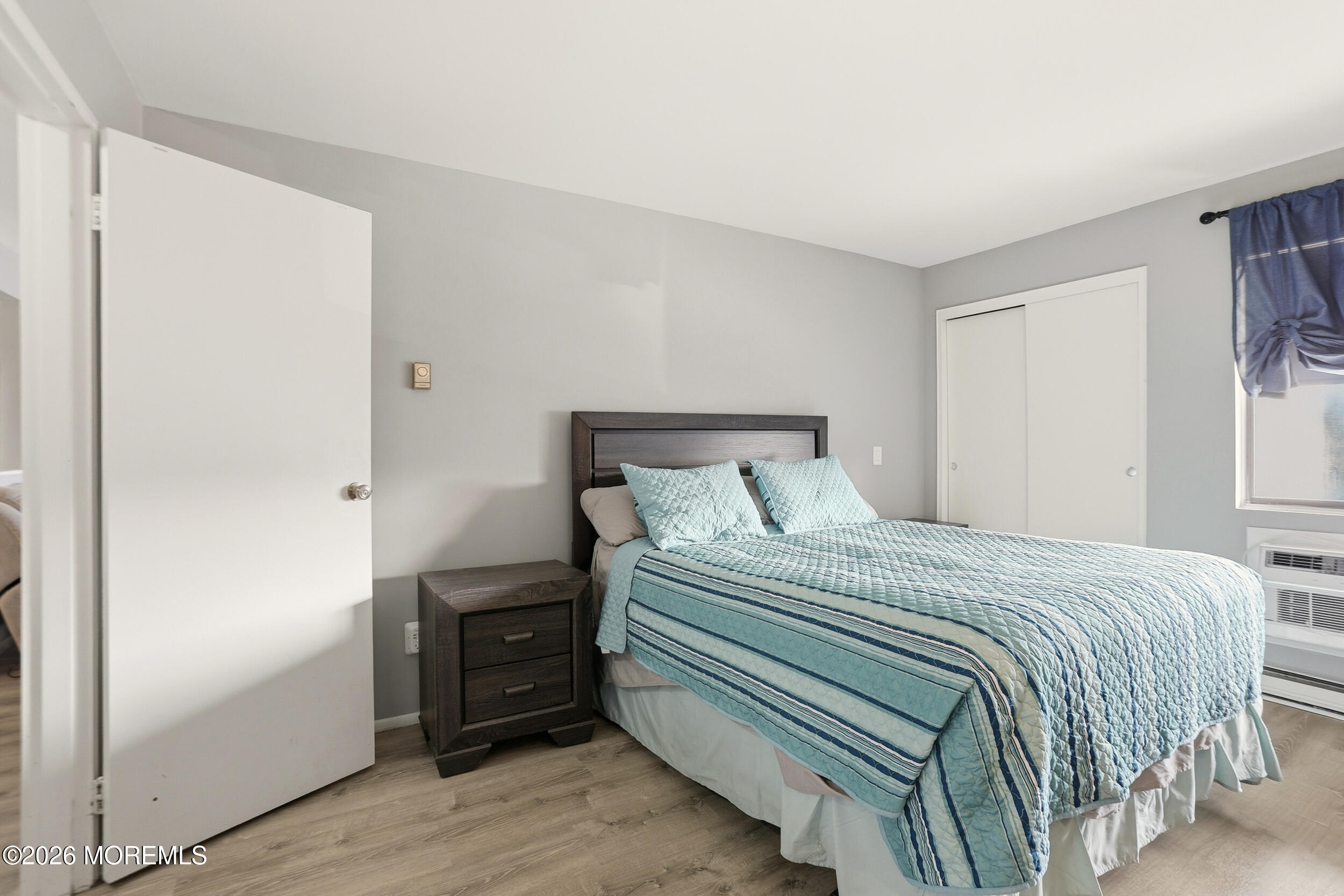 330 Shore Drive, Unit B7 Highlands, NJ 07732 - Photo 19 of 22 a bedroom with a bed and a window