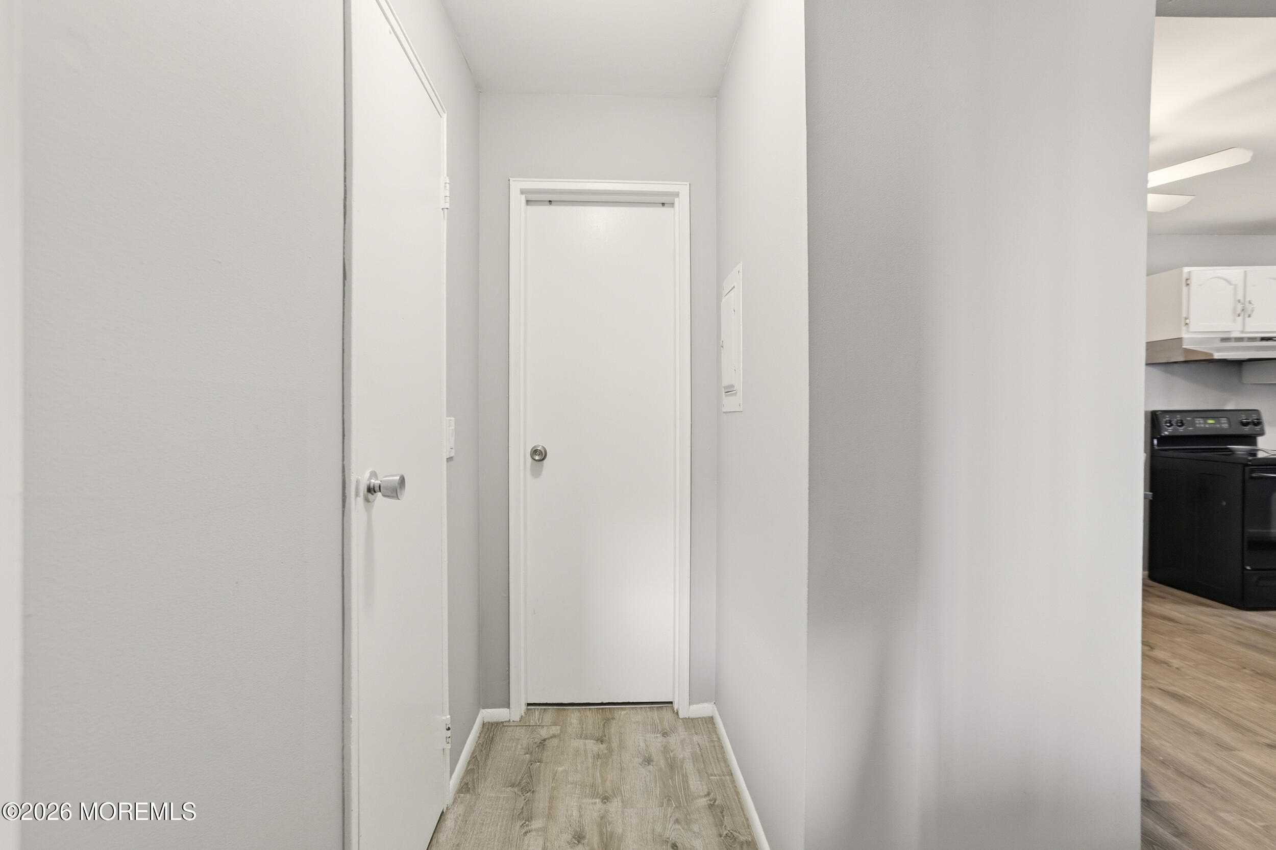 330 Shore Drive, Unit B7 Highlands, NJ 07732 - Photo 2 of 22 a view of a hallway with wooden floor and closet