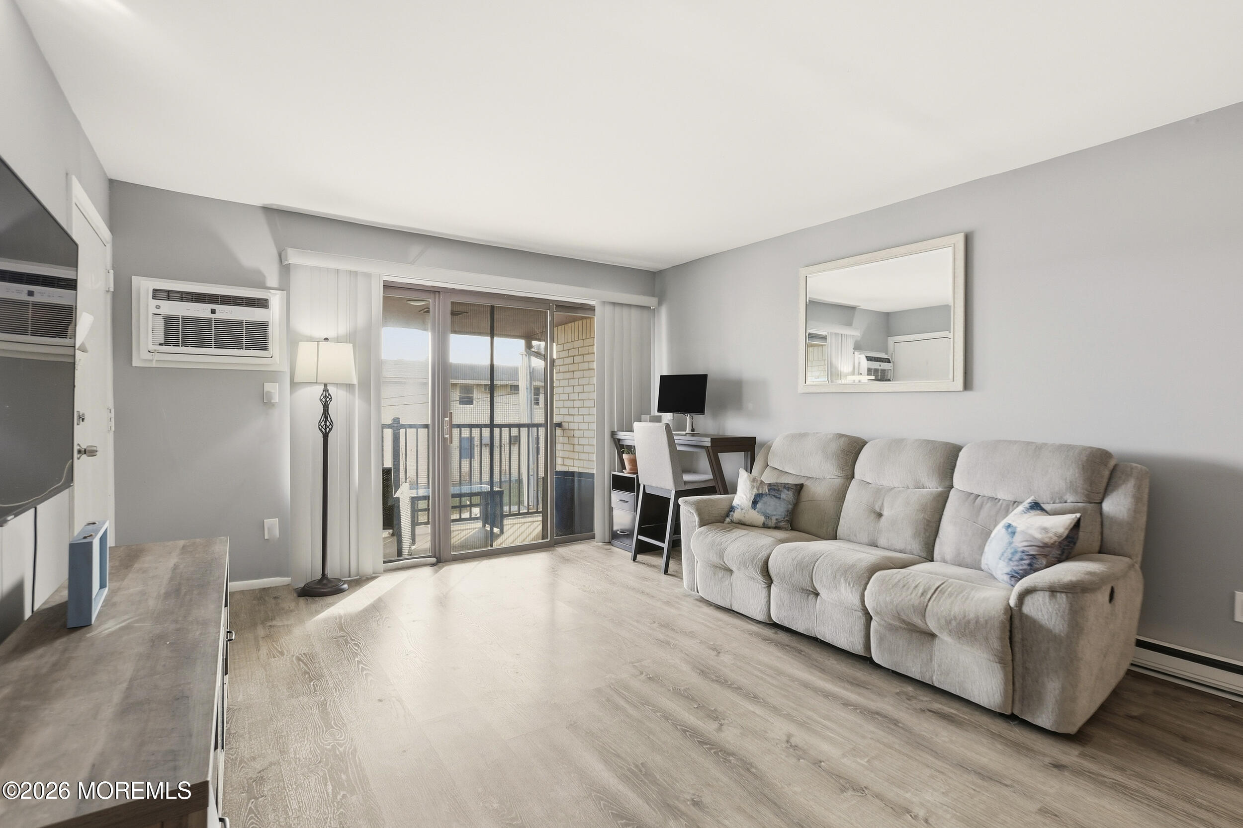 330 Shore Drive, Unit B7 Highlands, NJ 07732 - Photo 9 of 22 a living room with furniture and a flat screen tv