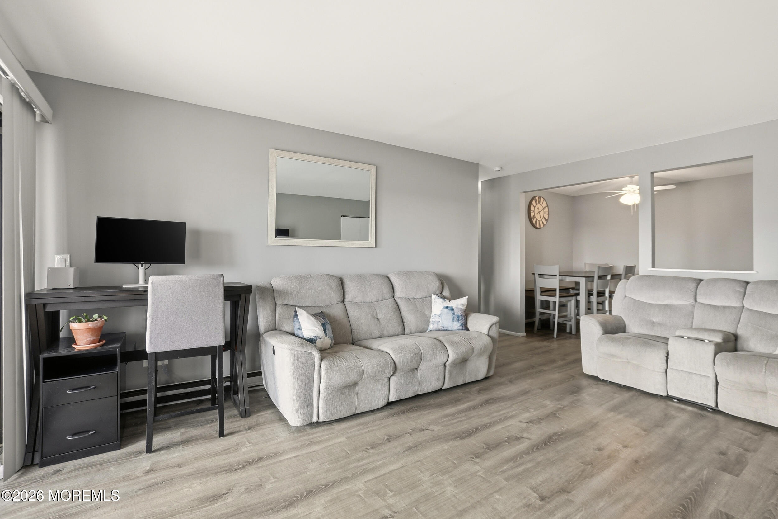 330 Shore Drive, Unit B7 Highlands, NJ 07732 - Photo 10 of 22 a living room with furniture and a flat screen tv