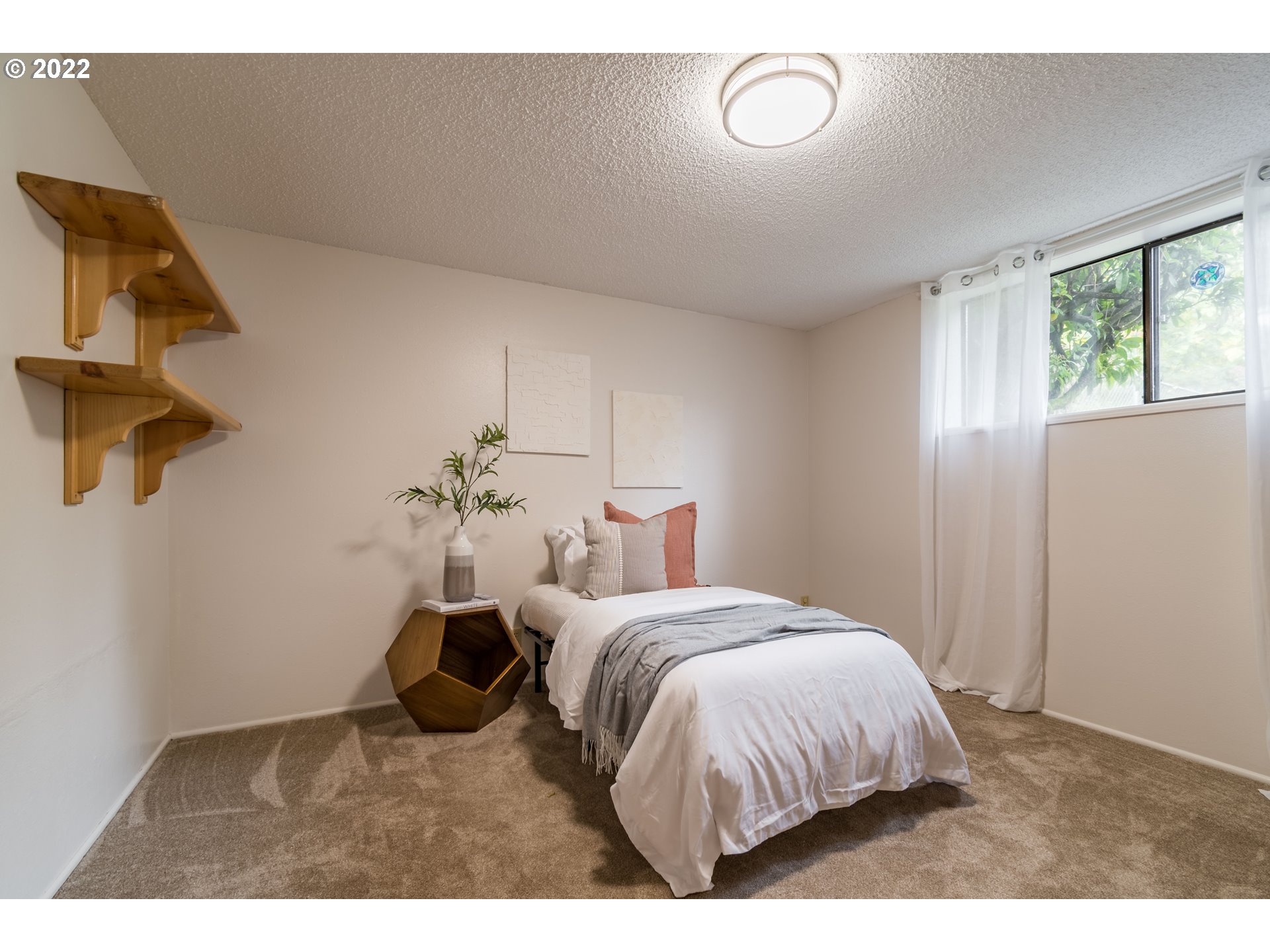 37911 Shenandoah Loop Springfield, OR 97478 - Photo 17 of 32 a bed room with a bed and a chandelier