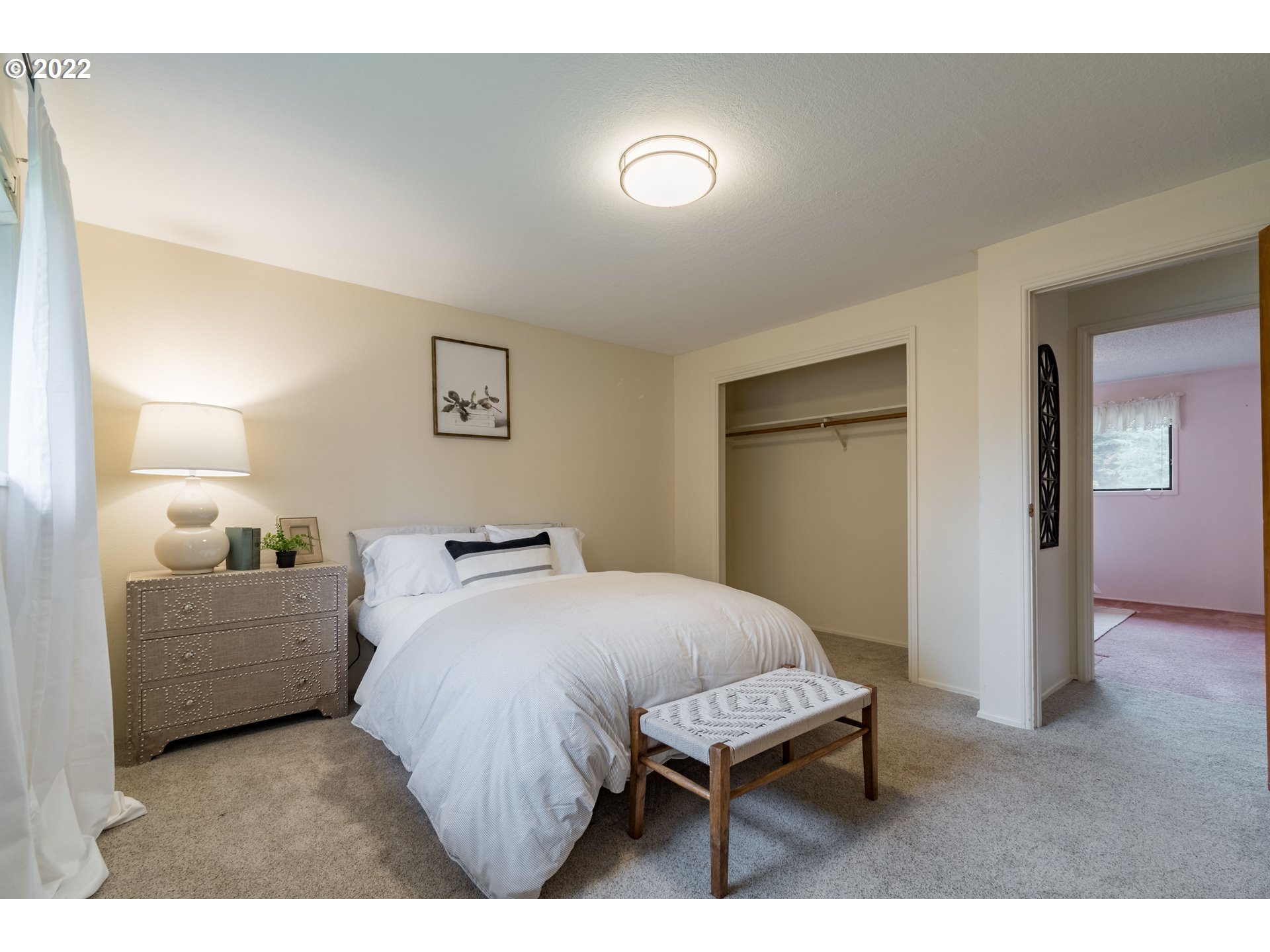 37911 Shenandoah Loop Springfield, OR 97478 - Photo 18 of 32 a bedroom with a bed and a flat screen tv