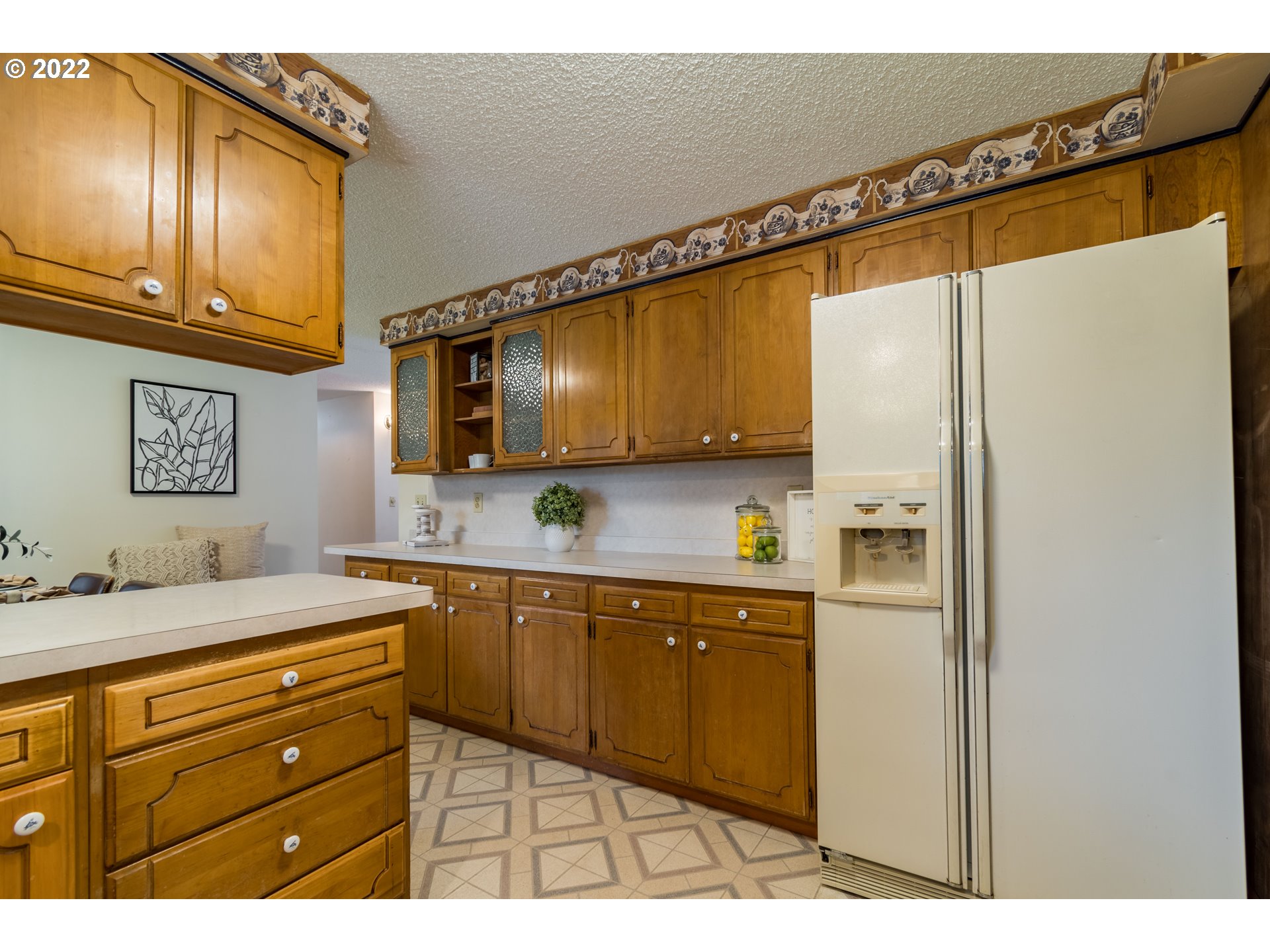 37911 Shenandoah Loop Springfield, OR 97478 - Photo 5 of 32 a kitchen with stainless steel appliances granite countertop a refrigerator and cabinets