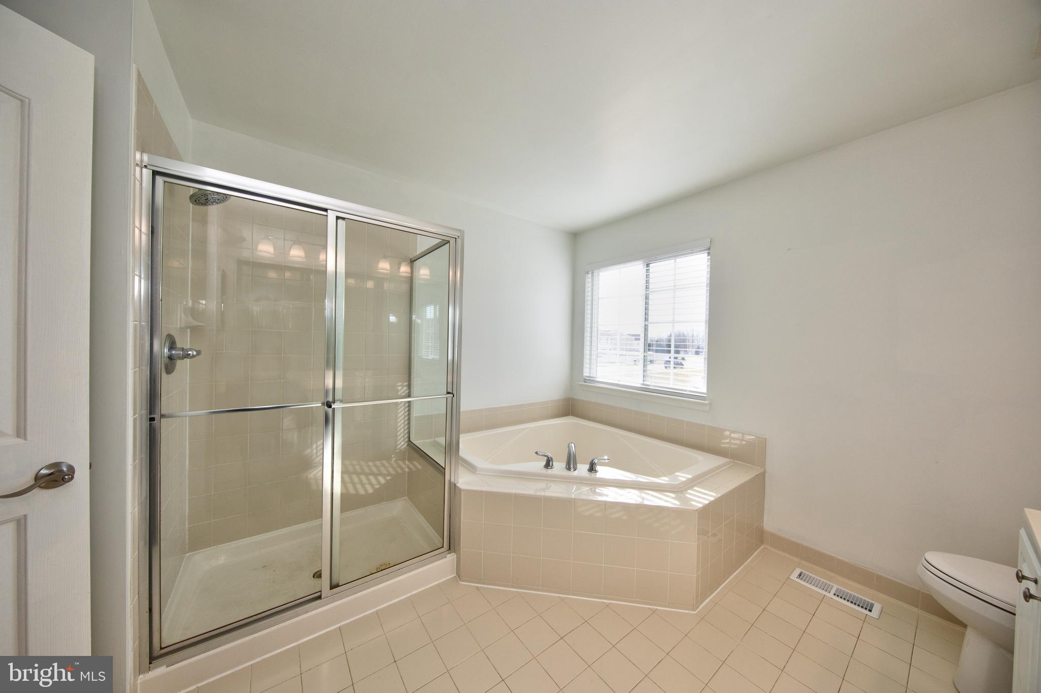 580 Callander Way Abingdon, MD 21009 - Photo 16 of 31 a bathroom with a bathtub and a shower