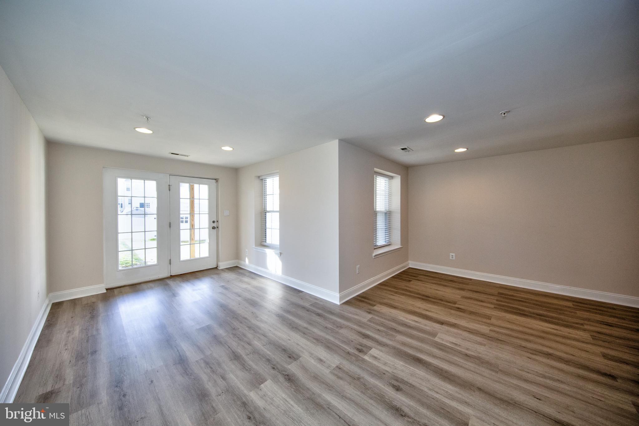 580 Callander Way Abingdon, MD 21009 - Photo 24 of 31 a view of an empty room with wooden floor and a window