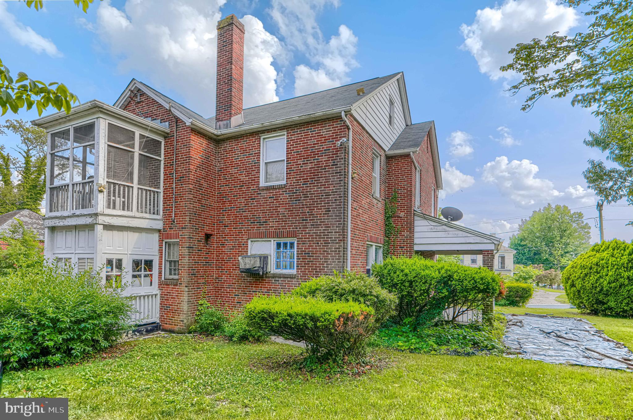 3212 Dorchester Road Baltimore, MD 21215 - Photo 5 of 45 a front view of a house with garden