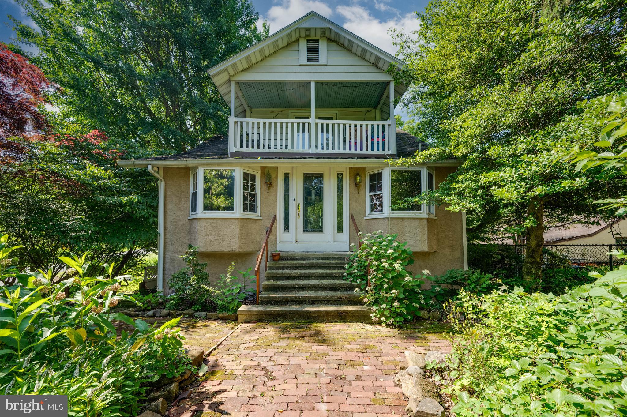 568 North Church Road Reading, PA 19607 - Photo 1 of 56 a view of a house with brick walls and flower plants