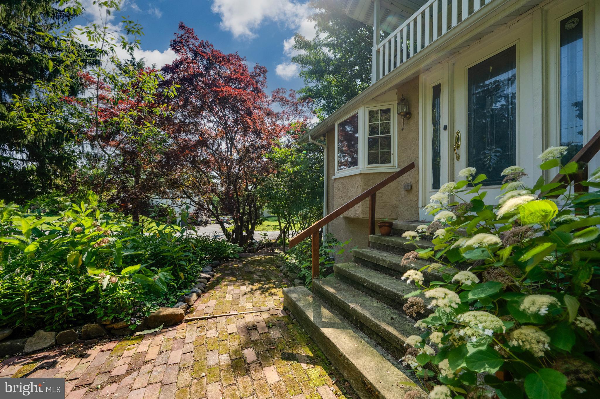 568 North Church Road Reading, PA 19607 - Photo 3 of 56 a view of a house with a flower garden