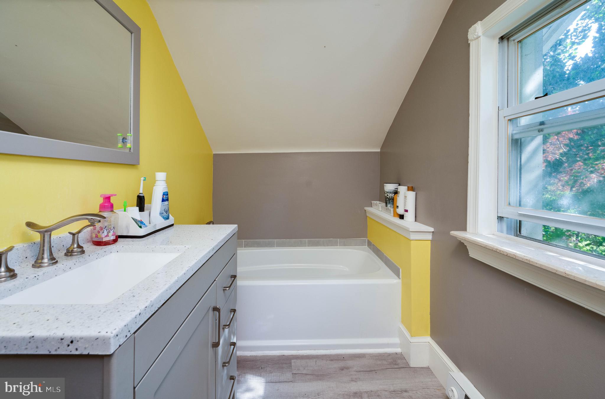 568 North Church Road Reading, PA 19607 - Photo 32 of 56 a bathroom with a tub sink and a mirror