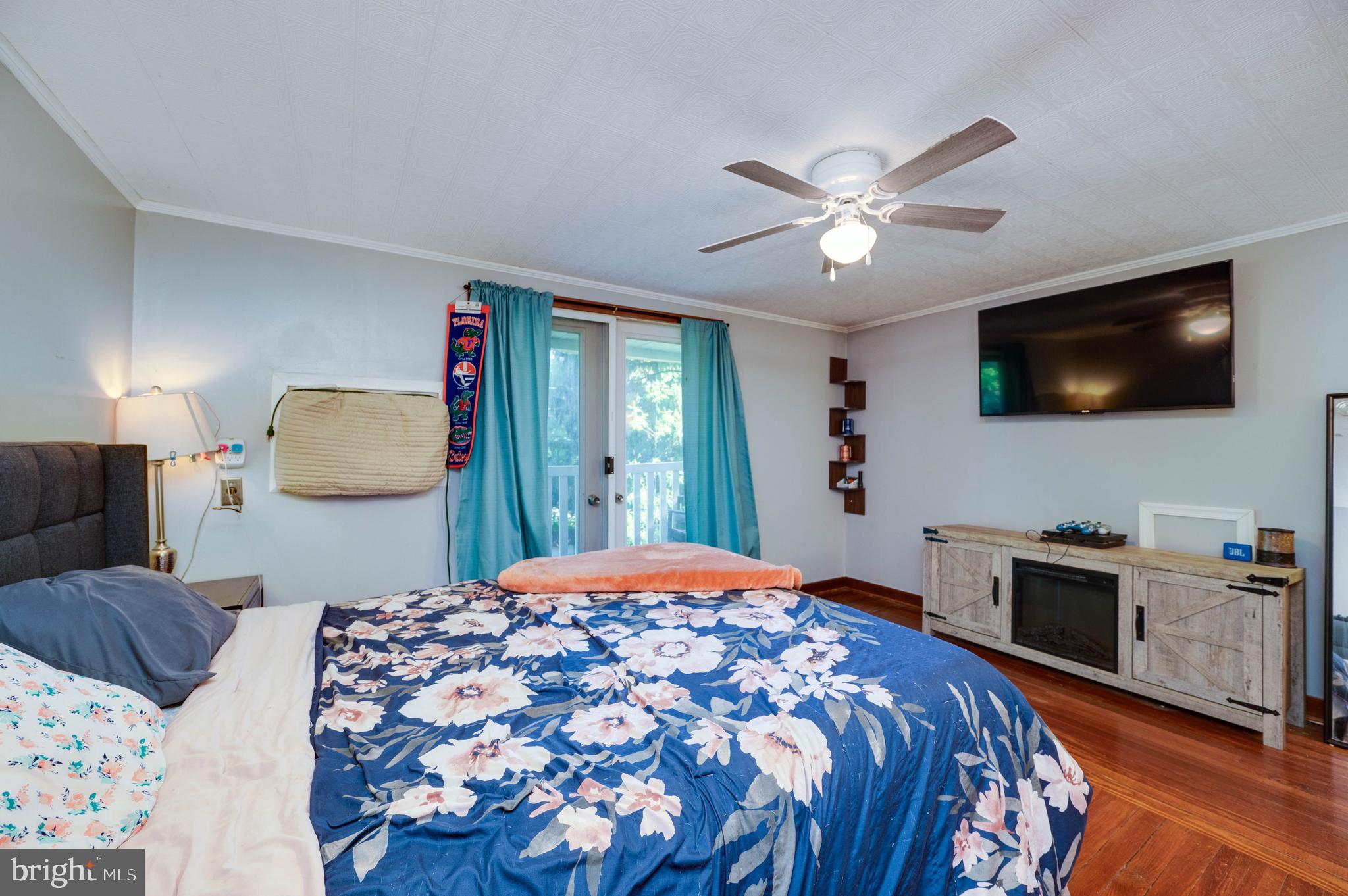 568 North Church Road Reading, PA 19607 - Photo 33 of 56 a bedroom with a large bed and a flat screen tv