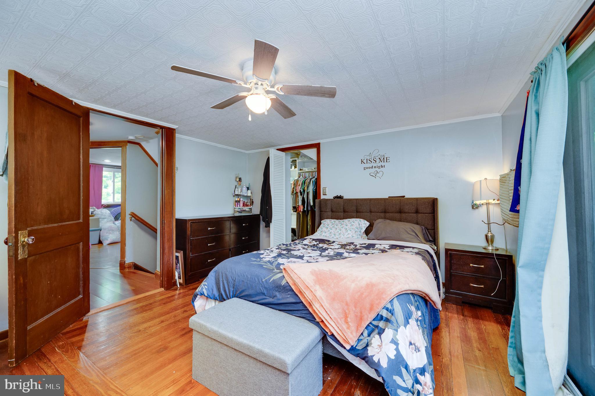 568 North Church Road Reading, PA 19607 - Photo 34 of 56 a bed room with a bed and a chandelier