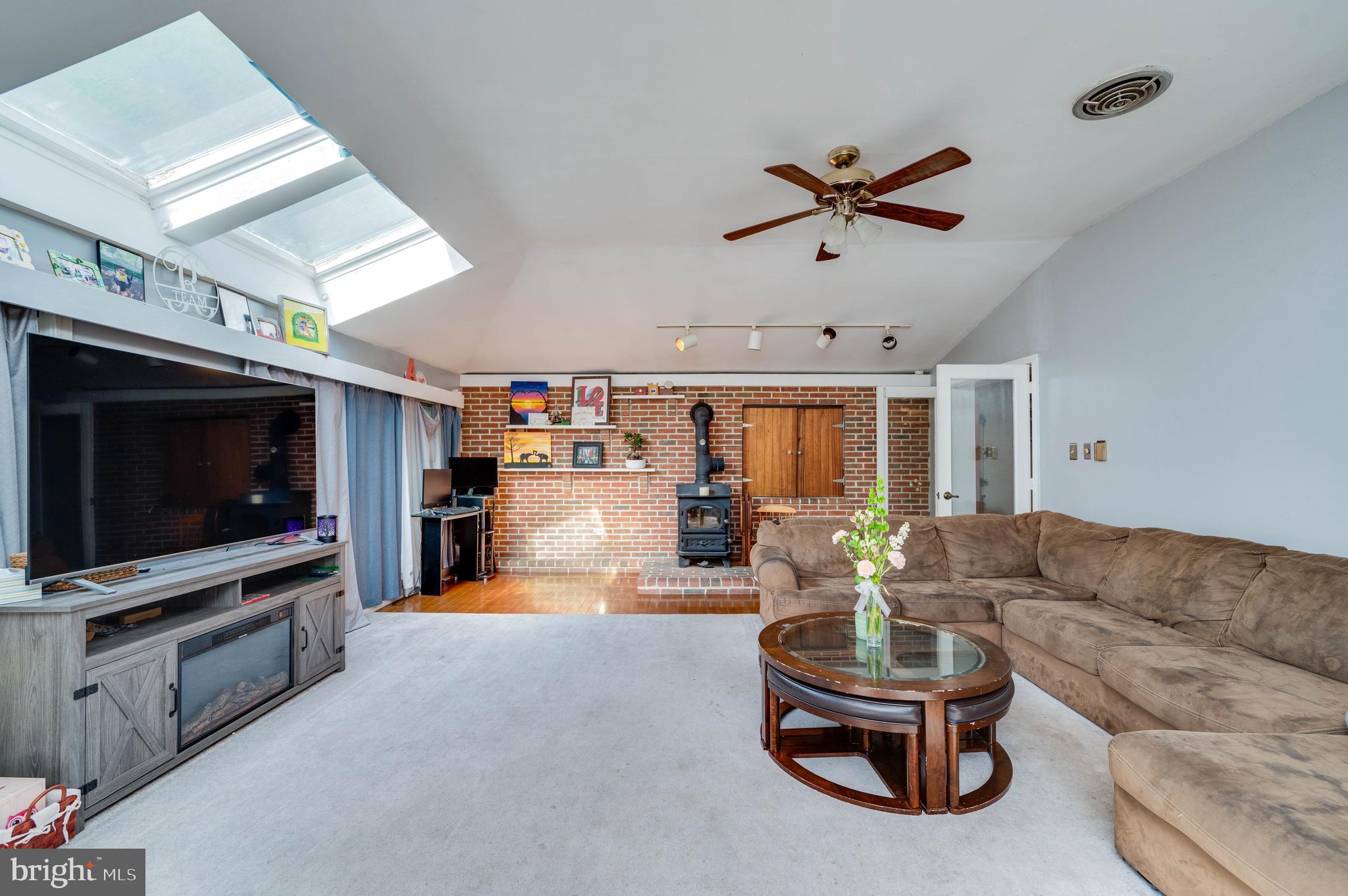 568 North Church Road Reading, PA 19607 - Photo 7 of 56 a living room with furniture a ceiling fan and a flat screen tv