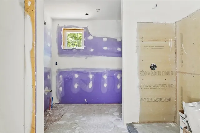 a bathroom with a tub shower sink and vanity