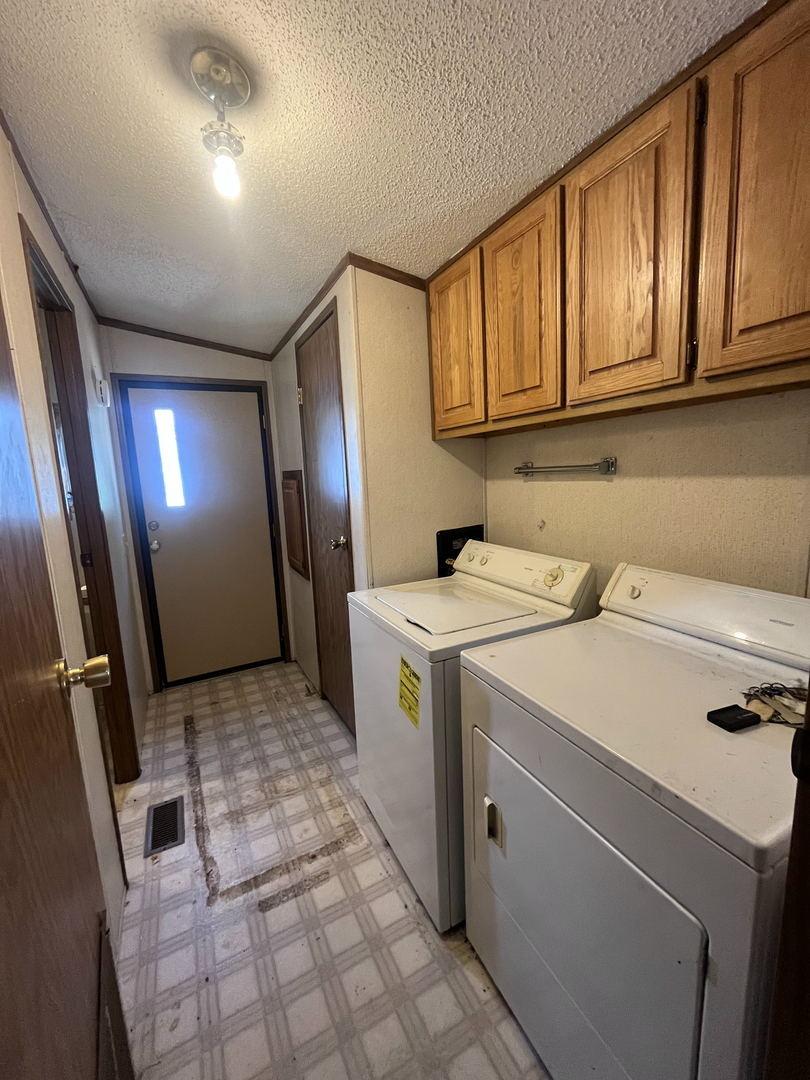 8653 Fig Tree Lane Roscoe, IL 61073 - Photo 11 of 22 a utility room with dryer and washer