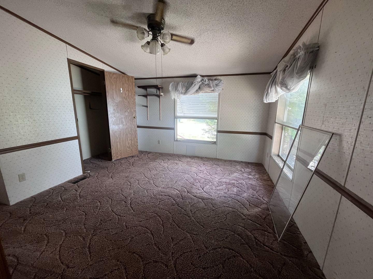 8653 Fig Tree Lane Roscoe, IL 61073 - Photo 17 of 22 a view of empty room with wooden floor and fan