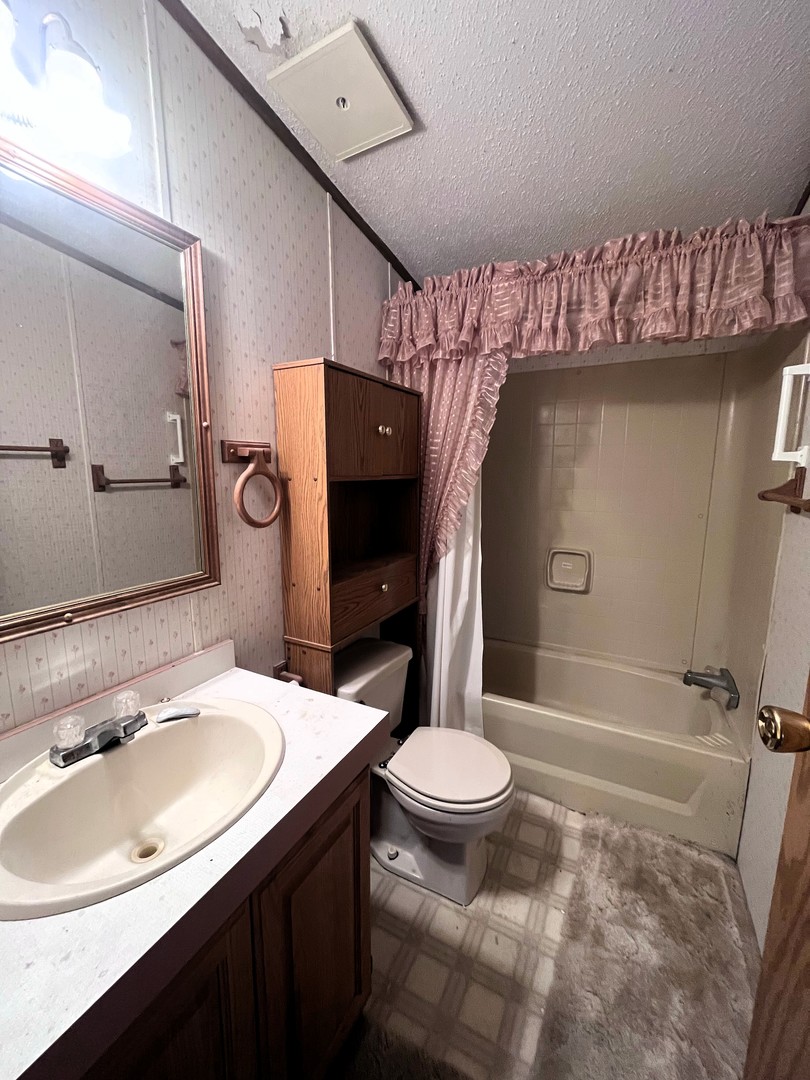 8653 Fig Tree Lane Roscoe, IL 61073 - Photo 18 of 22 a bathroom with a sink toilet and shower