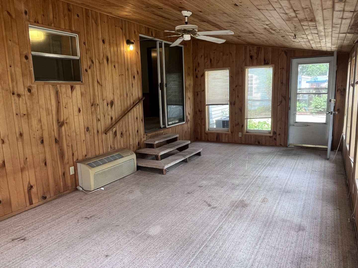 8653 Fig Tree Lane Roscoe, IL 61073 - Photo 19 of 22 a view of an empty room with a fireplace and a window