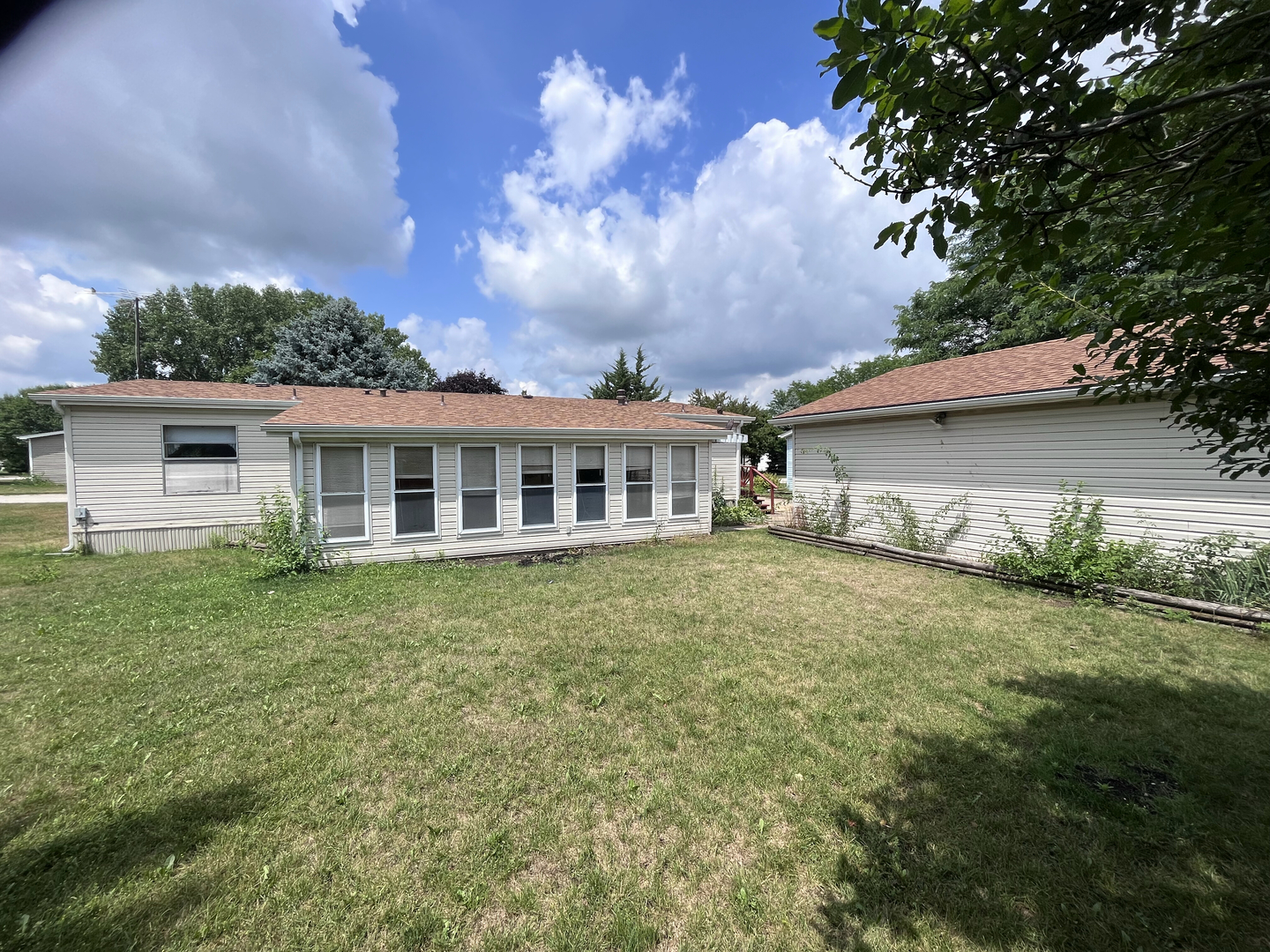 8653 Fig Tree Lane Roscoe, IL 61073 - Photo 22 of 22 a view of a house with a backyard