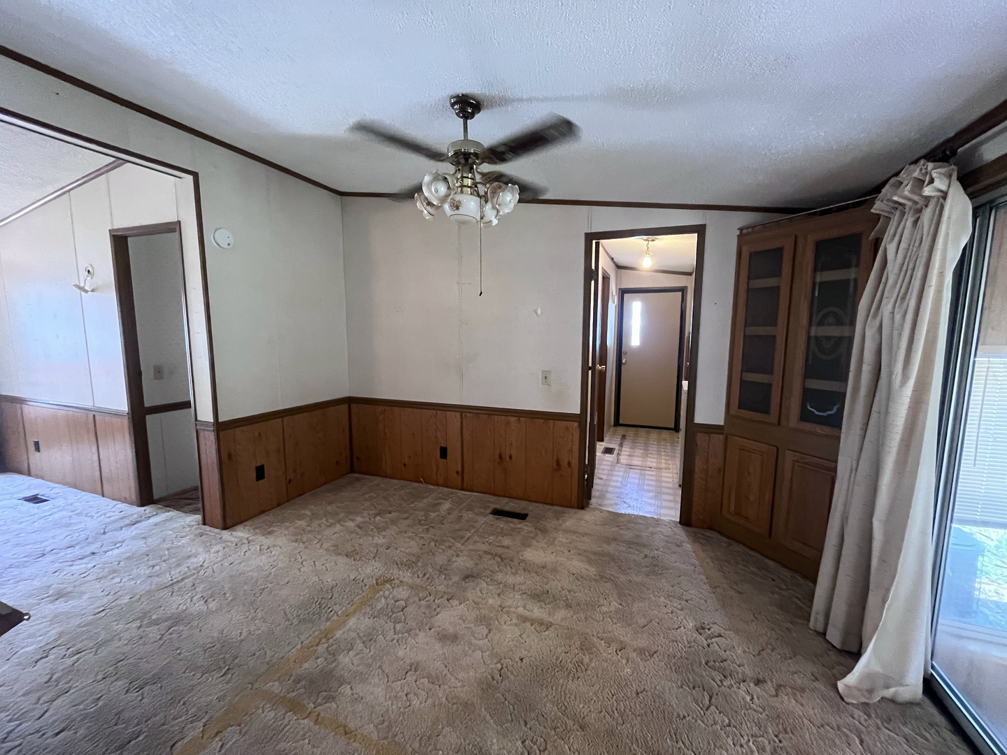 8653 Fig Tree Lane Roscoe, IL 61073 - Photo 8 of 22 wooden floor in an empty room with a window